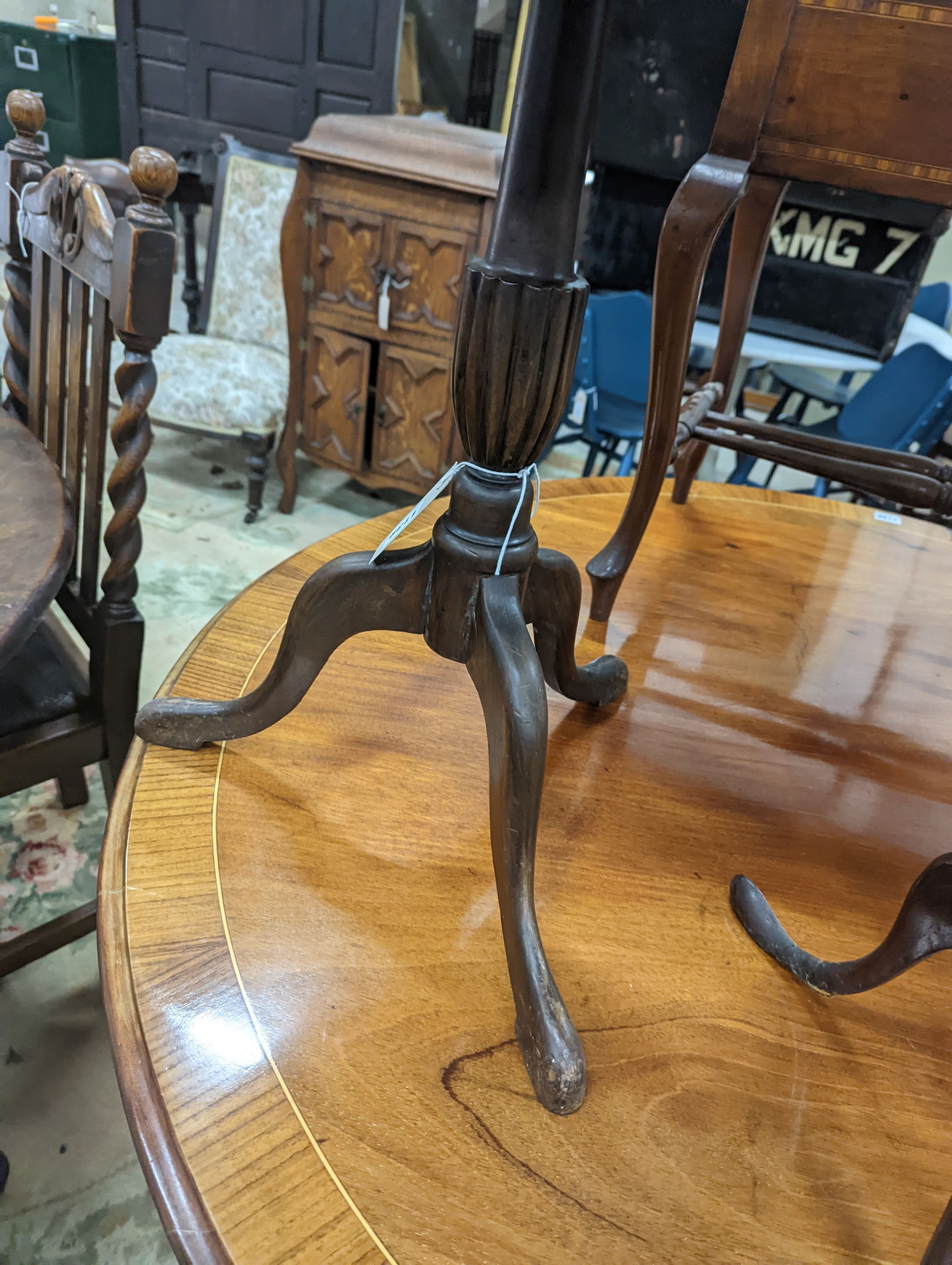 Two Edwardian inlaid mahogany tripod wine tables, larger height 50cm, together with a later folding oval wine table (3)